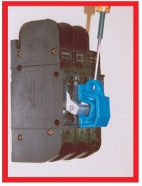 Blue plastic lockout device clamped to a breaker switch, with keyway and screw mount