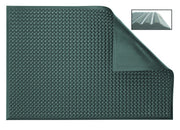 Green bubble mat with raised oval studs and corner fold detail, textured surface