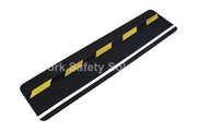 Safety grip strip with black surface, yellow hazard stripes, white reflective edges