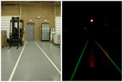 Glow floor tape on corridor floor, white strip with fire-exit arrows, green illuminated stripe