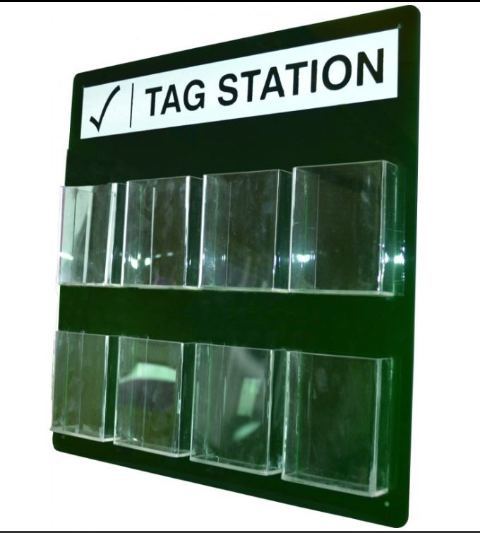 Green tag station board with two rows of empty clear compartments