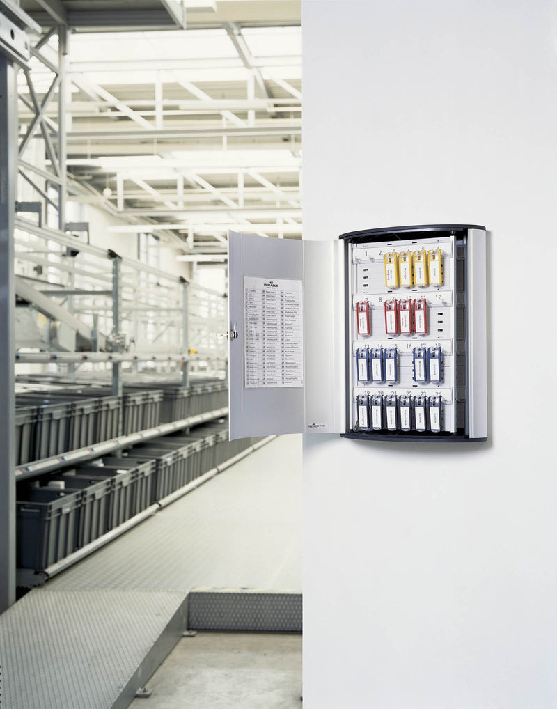 Wall-mounted key cabinet with cylinder lock and numbered key clips