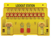Lockout station board with multiple padlock locks and safety tags in yellow tray