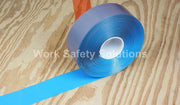 Blue safety floor tape roll with a tape strip extending across the floor