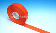 Safety floor tape roll with orange strip and white center roll hole